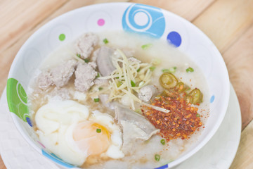 Traditional chinese porridge rice gruel in bowl.