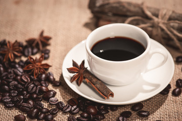 Coffee cup and coffee beans on table
