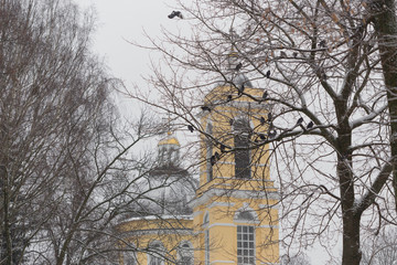 Fototapeta na wymiar Beautiful winter view of Cathedral of Peter and Paul in park, Gomel, Belarus.