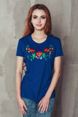 Photo of a beautiful girl in an embroidered shirt national ukrainian style. Woman with traditional dress