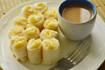 bread filled butter roll eat with coffee on plate