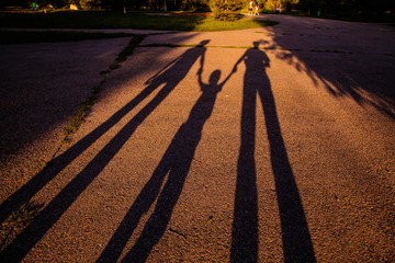 Happy family on the ground shadows 