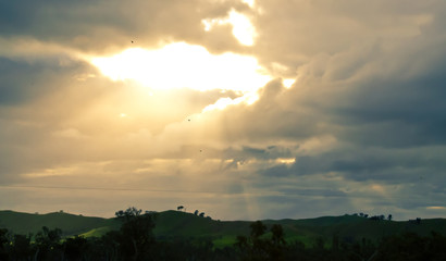 Sunlight breaking through heavy clouds