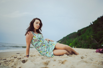 Fototapeta na wymiar Young woman on a beach