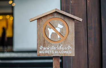 dog allowed sign in mini mall , English and Thailand language si
