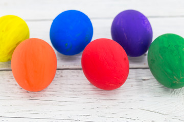 colorful eggs on wooden background