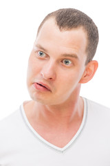 Obraz premium cheerful face with a grimace young man isolated
