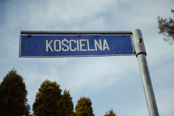 Winding road sign in the forest