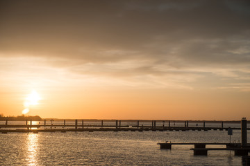 Fototapeta na wymiar Yacht port over orange sunset