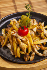 fried potatoes with mushrooms and chicken