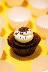 Birthday cupcake against a yellow background