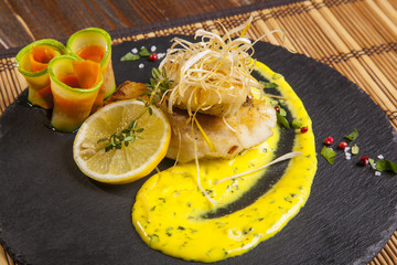Pike perch with sauce and lemon