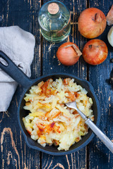 Fried potatoes with onions in cast-iron frying pan
