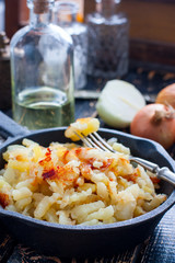 Fried potatoes in an iron pan