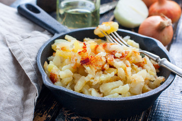 Fried potatoes in an iron pan