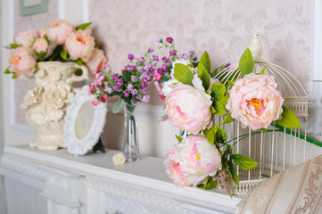 decorations with flowers on the shelf in the interior in the living room