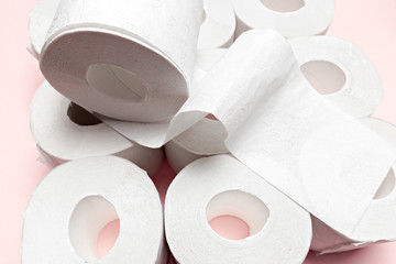 Toilet paper on pink background