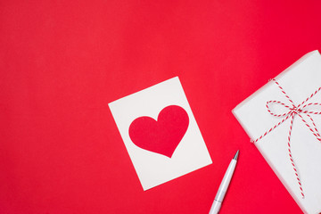 Valentines Day gift box and greeting card isolated on color back