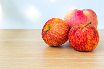Red apple on wooden table