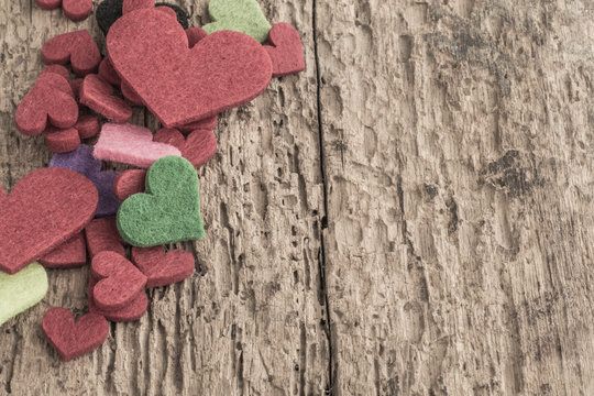 colorful hearts on wooden background