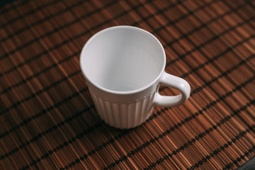 bright mug on the table, wooden background
