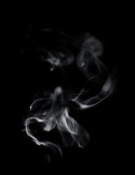 White smoke on black background