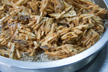  sliced Taro fritters in a dish