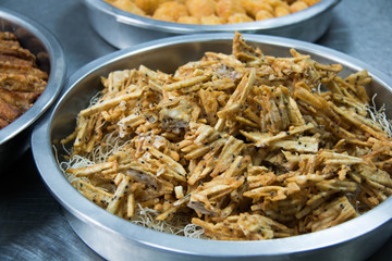  sliced Taro fritters in a dish