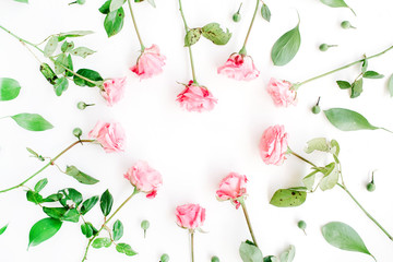 Heart symbol made of pink roses on white background. Flat lay, top view. Valentine's background.