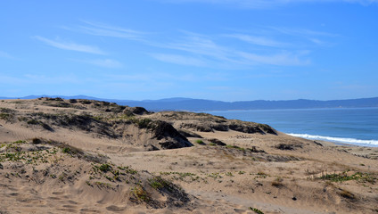 Sand Dunes and Beach near Monterey at the Pacific Coast with blue sky