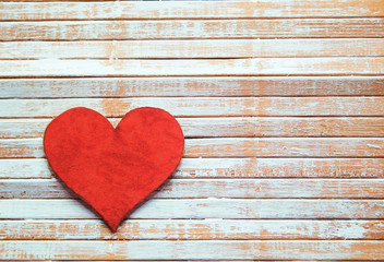 heart on wooden background, painted with white paint