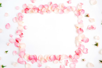Fototapeta na wymiar Frame made of pink roses petals on white background. Flat lay, top view. Valentine's background