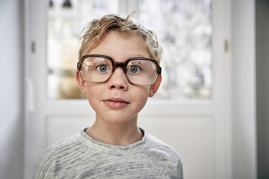 Portrait of boy wearing oversized glasses