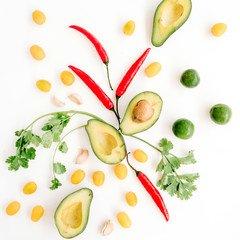 Raw food ingredients of guacamole: avocado, chili pepper, coriander, cherry tomato, lime, garlic. Flat lay, top view. Food concept.
