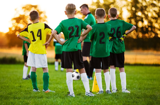 Football Soccer Training for Children. Soccer Team Training on Pitch. Young Boys Standing in a Row. Youth Football Team with Coach on Training Session. Soccer Horizontal Background