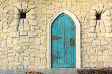 Old blue wooden door from an medieval construction