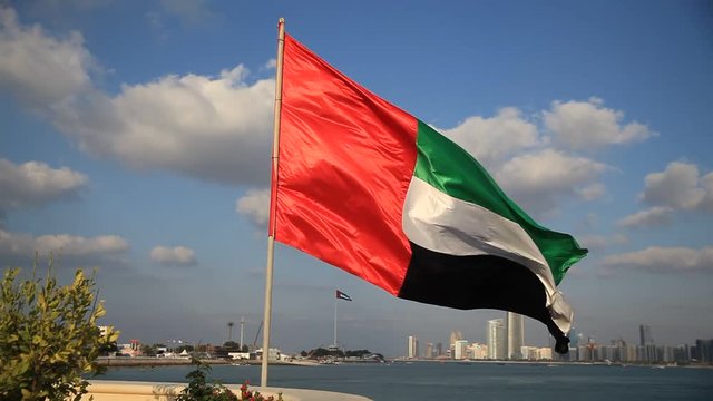 UAE flag waving with the background of Abu Dhabi Skyline as part of 43rd National Day celebrations