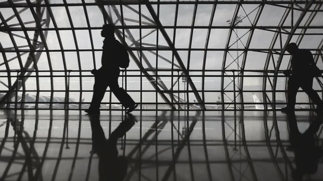 Silhouettes of Travellers in Airport
