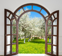 Fototapeta premium open door arch garden bloom in spring
