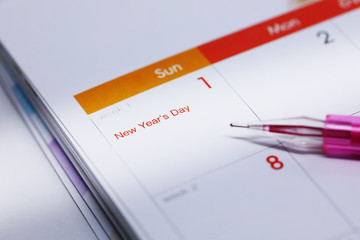 pen writing work schedule on desktop calendar of 1 january 2017