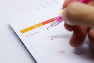 pen writing work schedule on desktop calendar of 1 january 2017