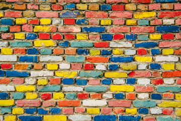Multicolored painted bricks, exterior wall as background
