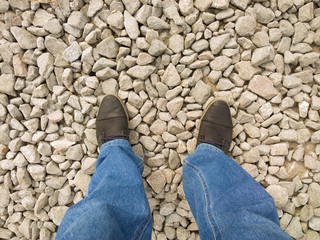 Feet on gravel.