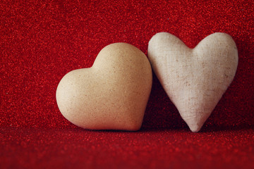 Obraz premium Hearts on red shiny background