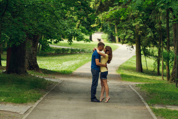 A love story couple, in love, together in the forrest park, girl, sunny evening, summer
