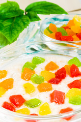 View close-up on oatmeal with colorful candied fruits