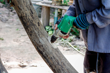 man with electric drill