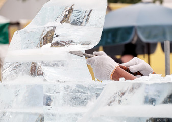 Ice sculpture carving / View of sculptor carving ice. Movement. - 131728149
