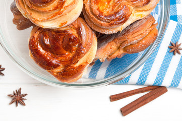 Homemade buns with cinnamon sticks