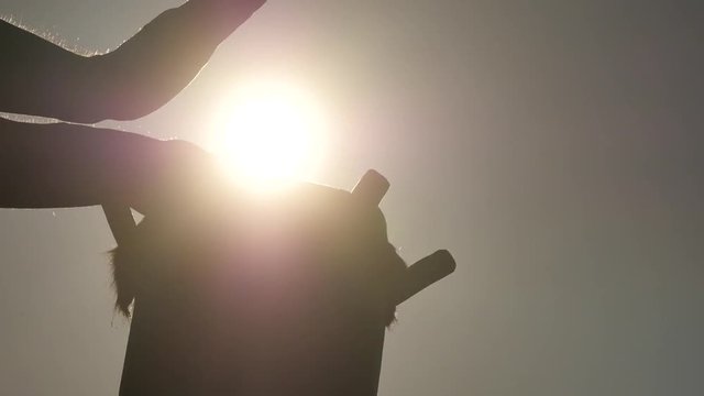 Psychedelic fast playing on tribal drum silhouette closeup